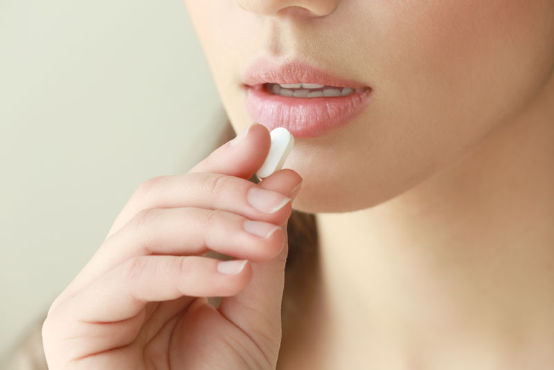 Dental Patient Taking Dental Sedative Pill