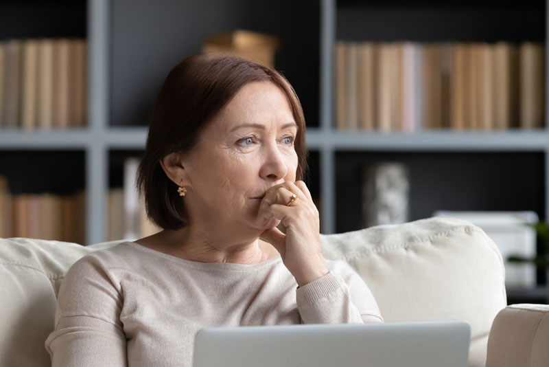 Dental Patient Wondering If She Should Get Dental Implants Or Dentures in St. Johns, MI