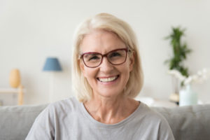 Dental Patient Smiling After Getting Dental Implants In St. Johns, MI