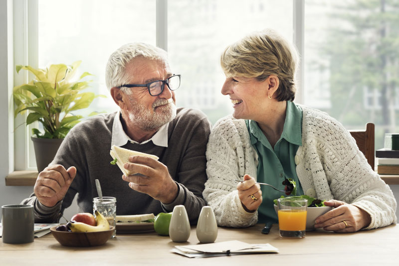 Dental Implant Patients Eating Together In St. Johns, MI