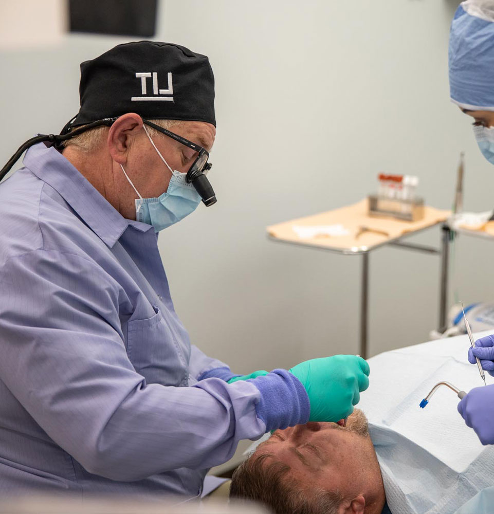 Dr. Connely performing dental procedure